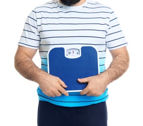 Photo of Overweight man with scale on white background