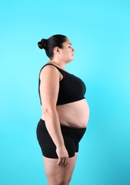 Photo of Fat woman on color background. Weight loss