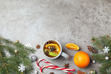 Photo of Aromatic white mulled wine on light grey table, flat lay. Space for text