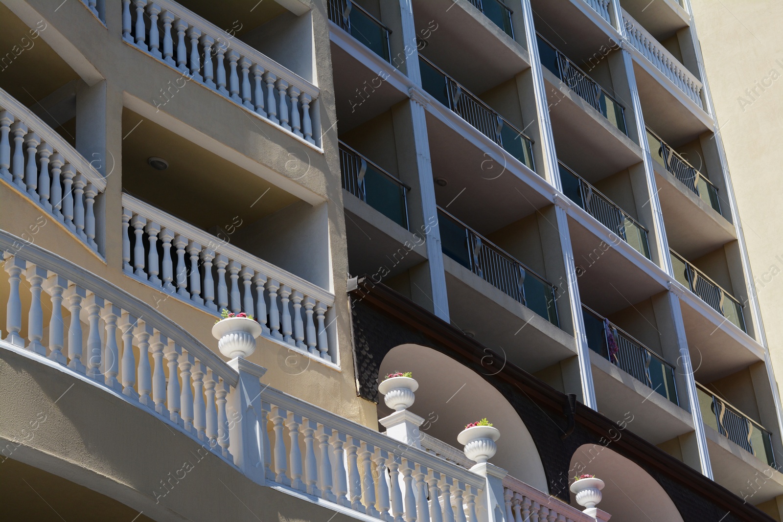 Photo of Exterior of residential building with balconies, low angle view