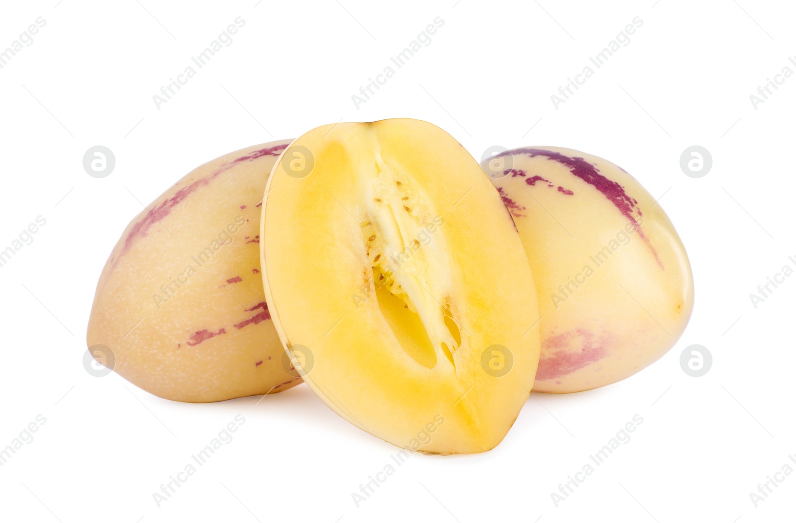 Photo of Whole and cut fresh pepino melons on white background