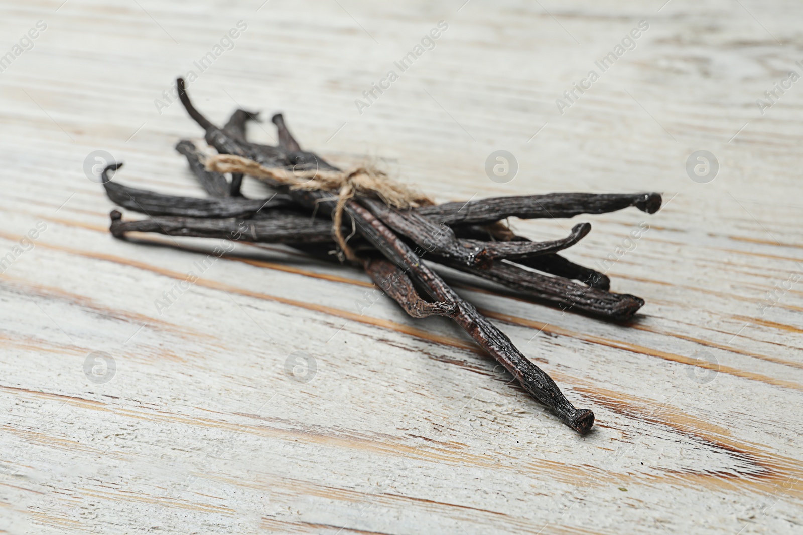 Photo of Vanilla sticks on wooden background