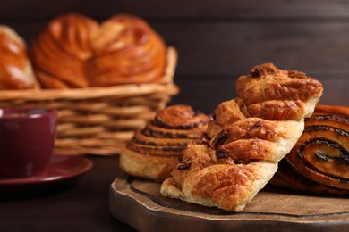 Photo of Different tasty freshly baked pastries on table, closeup. Space for text