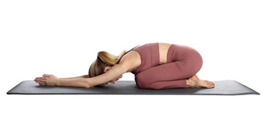 Photo of Young woman in sportswear practicing yoga on white background