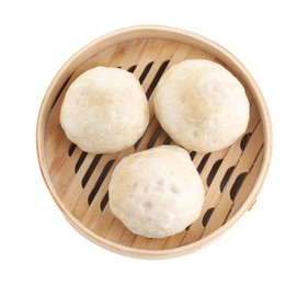 Delicious chinese steamed buns in bamboo steamer isolated on white, top view