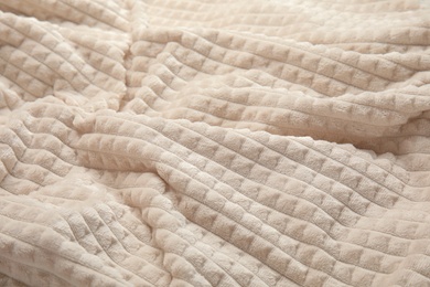 Soft warm white plaid as background, closeup