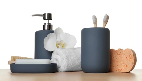 Photo of Bath accessories. Different personal care products and flower on wooden table against white background