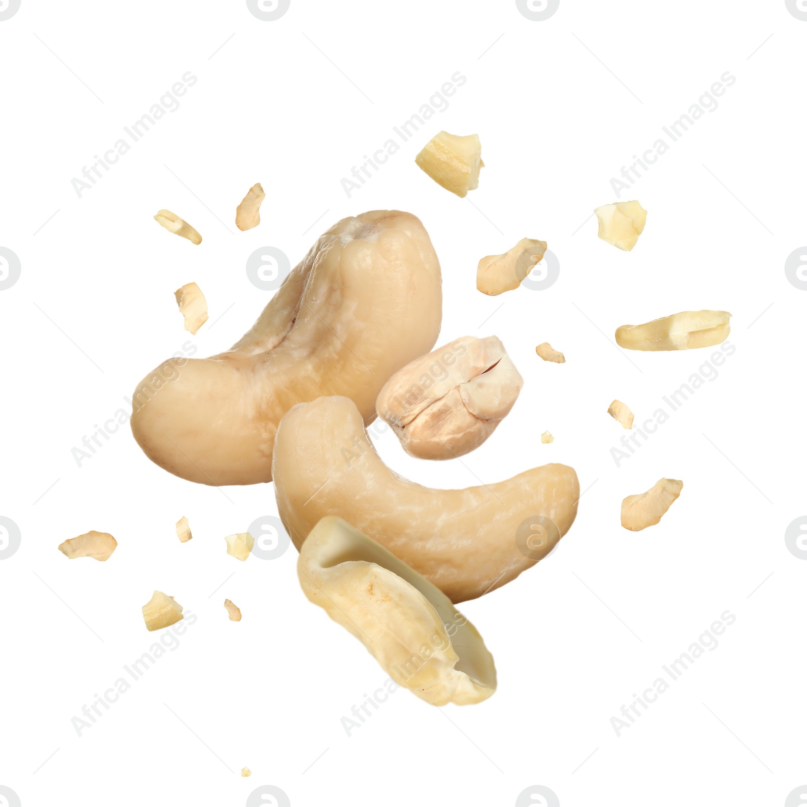 Image of Tasty cashew nuts flying on white background