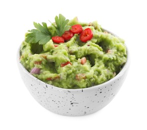 Photo of Delicious guacamole served with pepper and parsley isolated on white