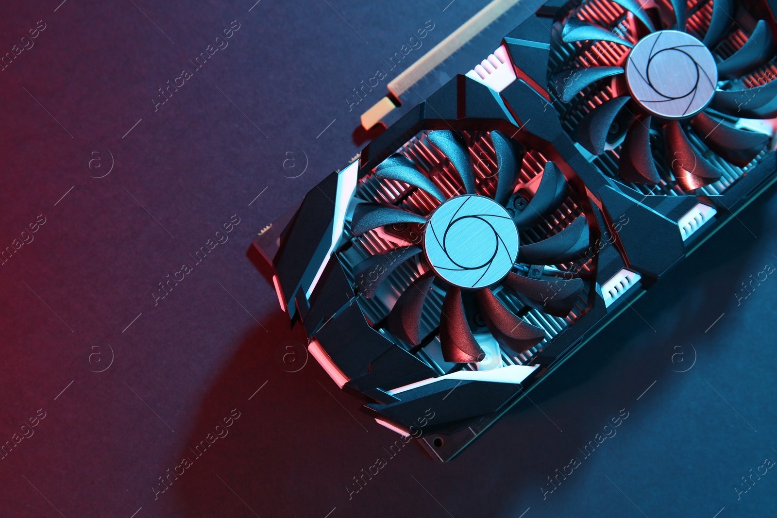 Photo of Computer graphics card on color background, top view. Space for text