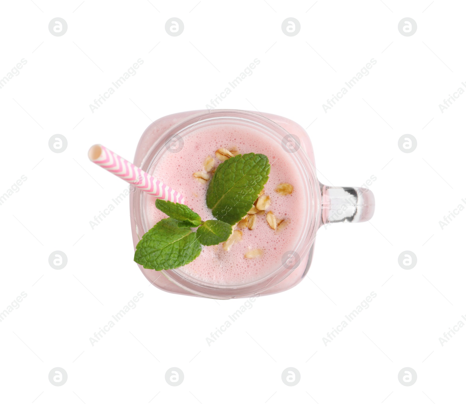 Photo of Mason jar of tasty strawberry smoothie with oatmeal and mint on white background, top view