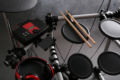 Photo of Modern electronic drum kit and smoke on grey background. Musical instrument