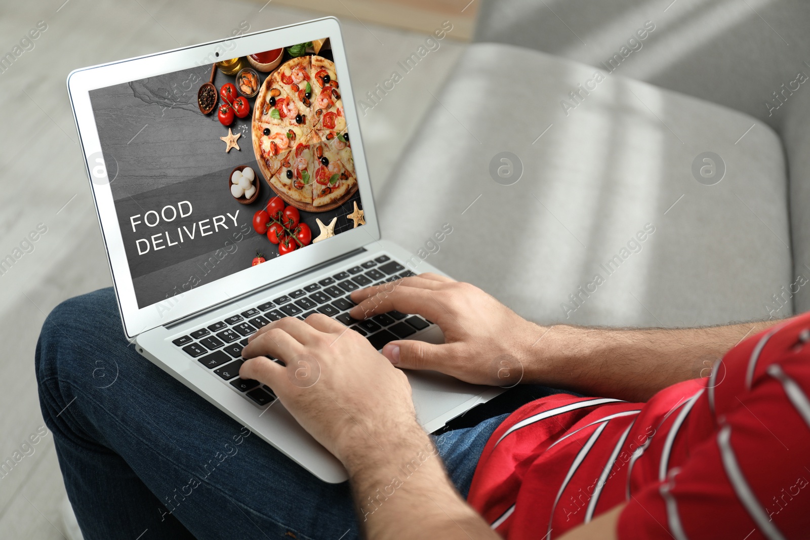 Image of Man using laptop for online food order during quarantine, closeup. Delivery service