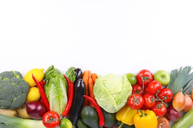 Heap of fresh ripe vegetables and fruits on white background, top view