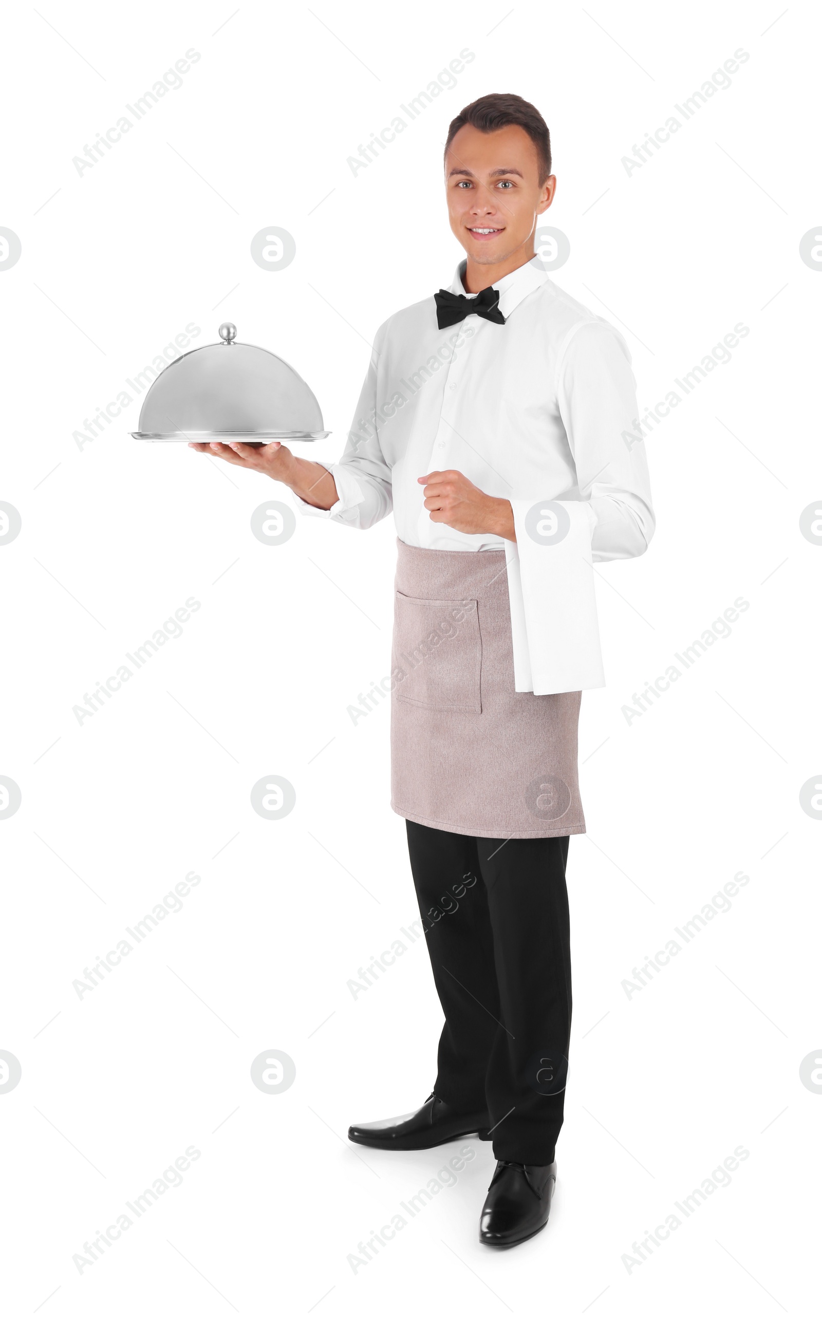 Photo of Waiter holding metal tray with lid on white background