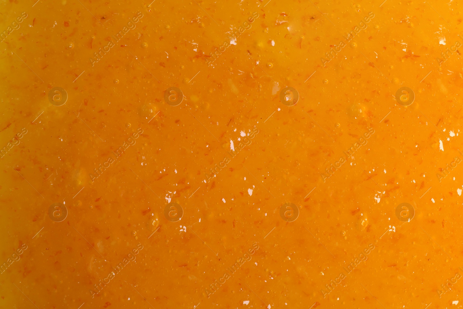 Image of Sweet apricot jam as background, closeup view