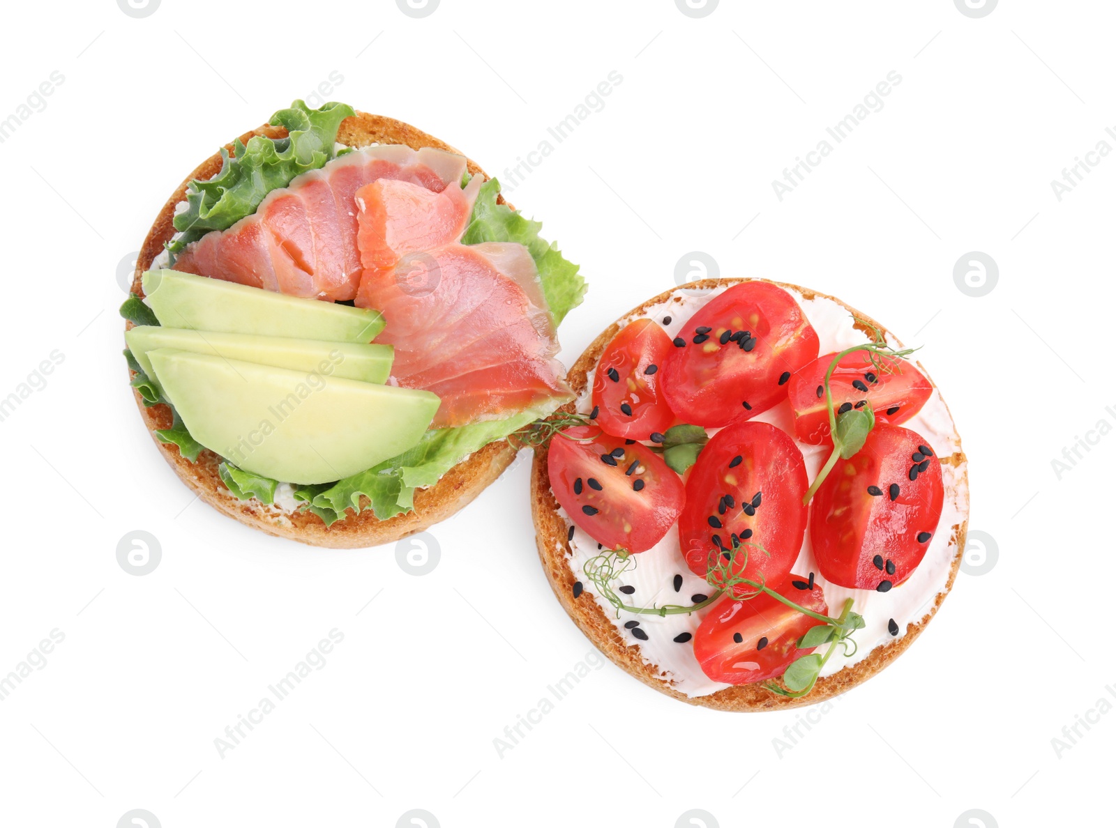 Photo of Tasty rusks with different toppings isolated on white, top view