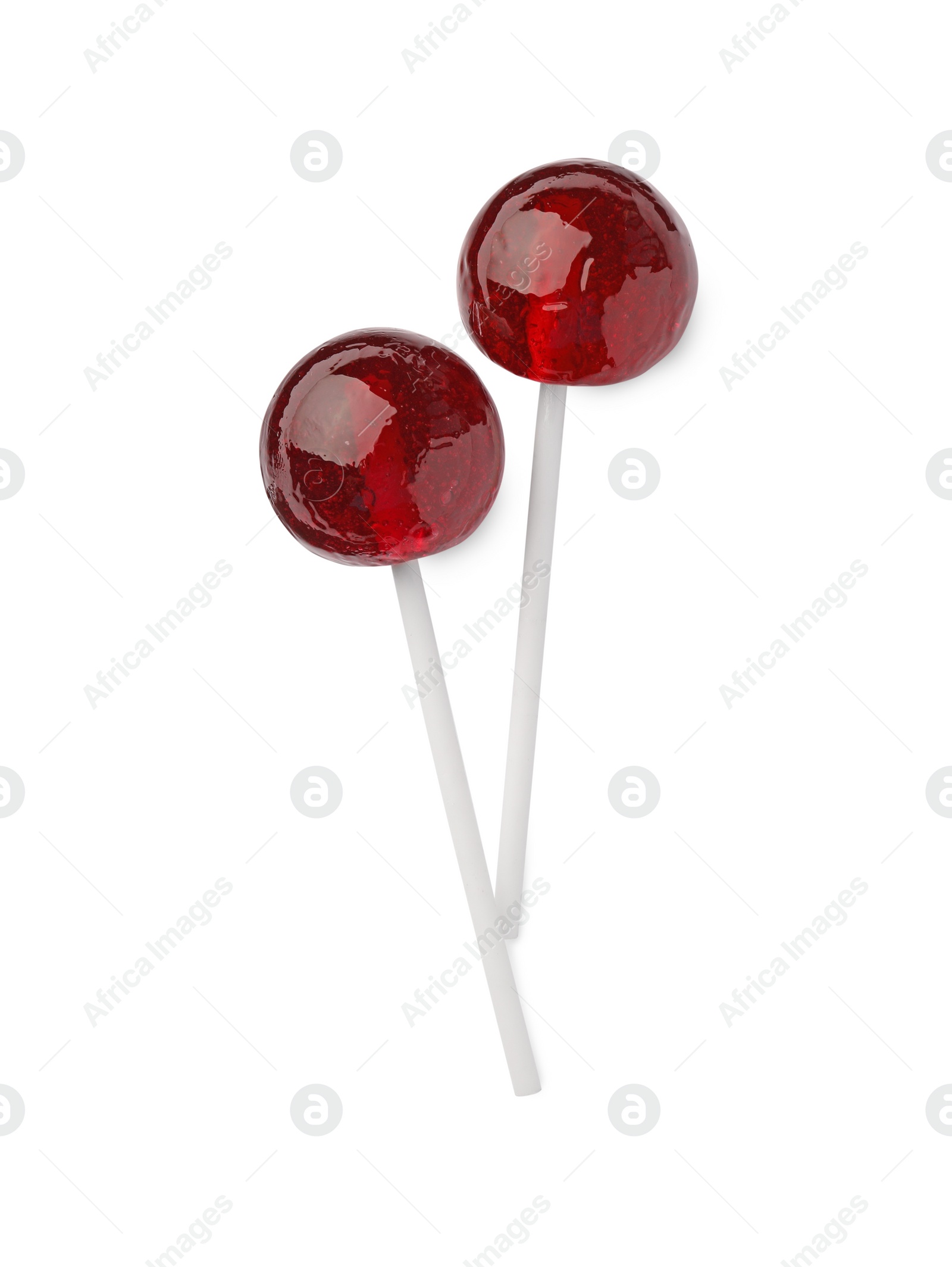 Photo of Two sweet red lollipops isolated on white, top view