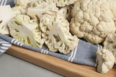 Fresh raw cauliflower on light grey table, closeup