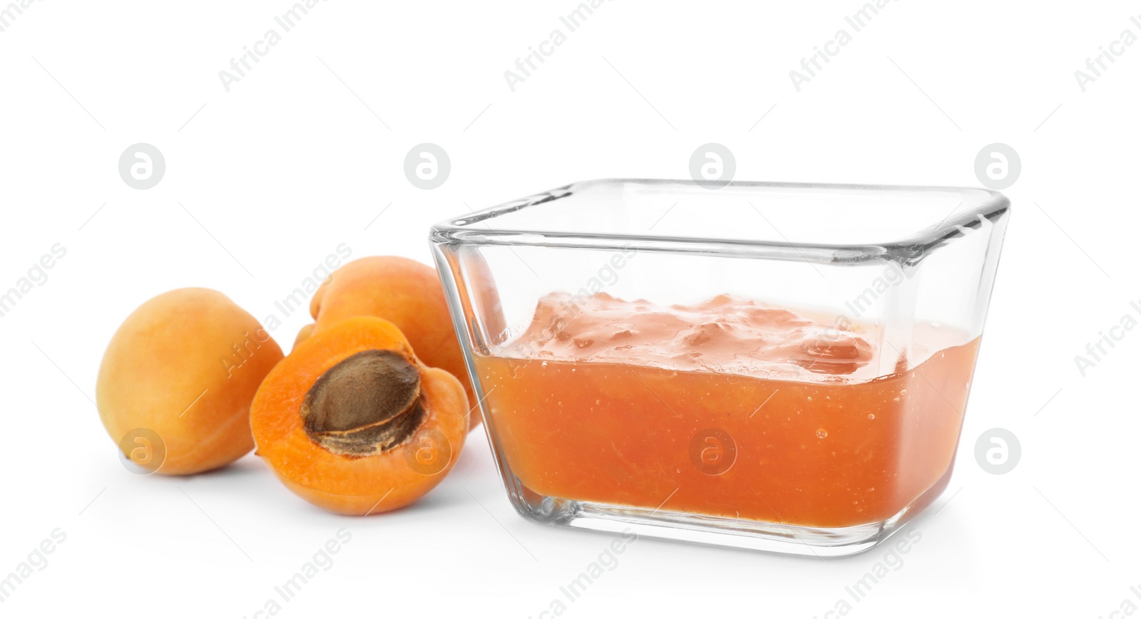 Photo of Bowl with tasty apricot jam and fruits on white background