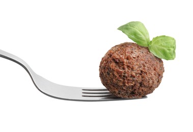 Photo of Delicious falafel ball, basil and fork isolated on white