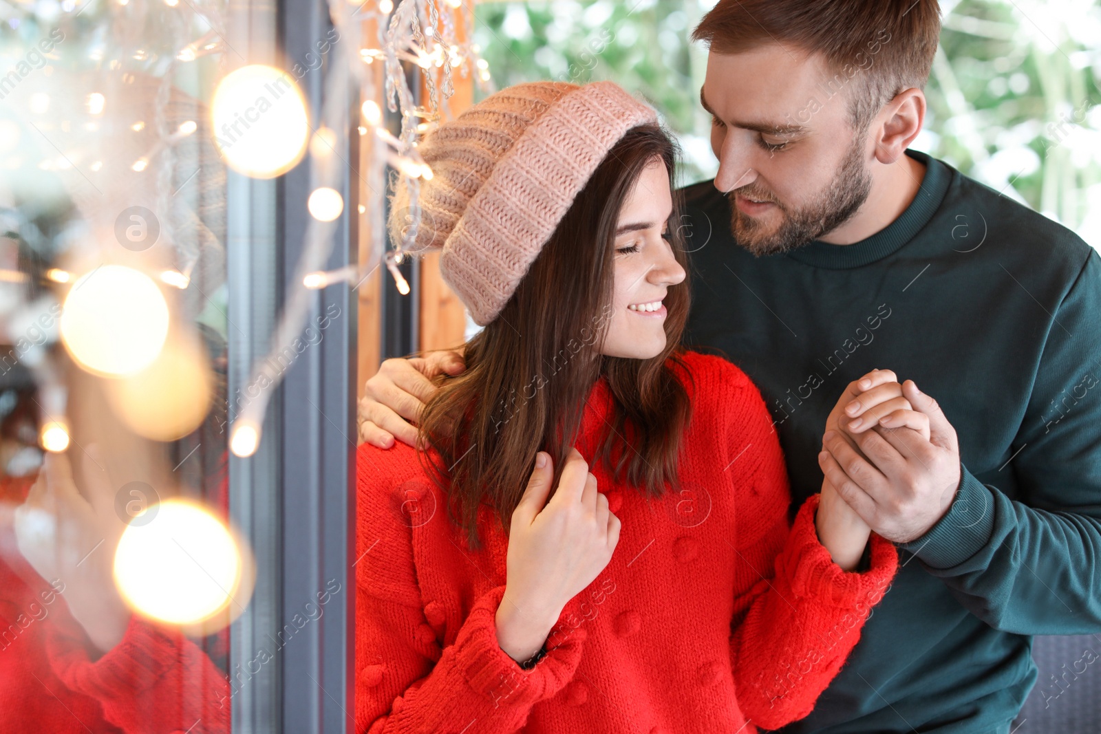 Photo of Lovely couple spending time together in cafe. Winter vacation