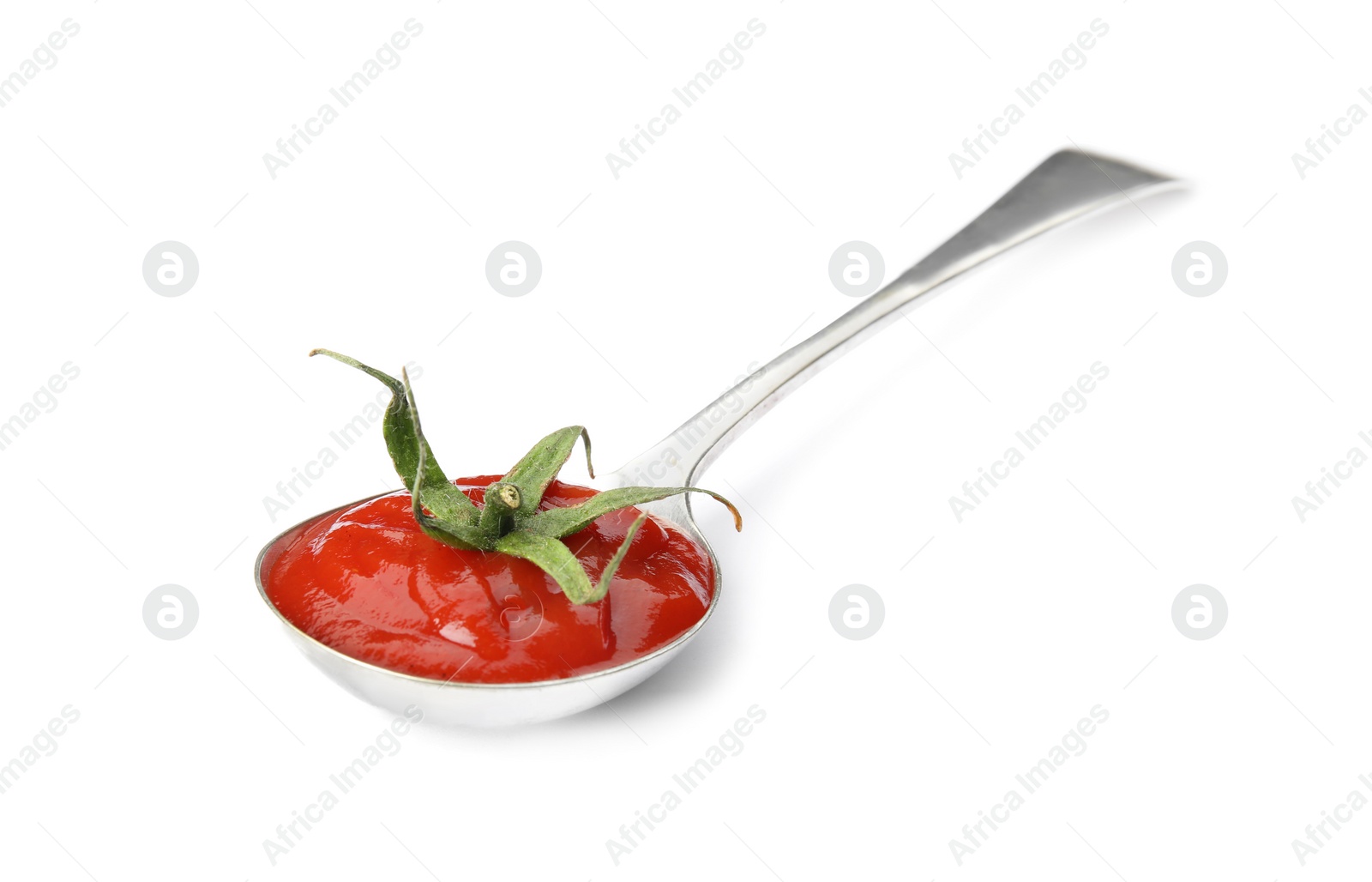 Photo of Tasty homemade tomato sauce and calyx in spoon on white background