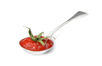 Photo of Tasty homemade tomato sauce and calyx in spoon on white background