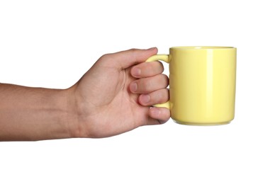 Photo of Man holding yellow mug on white background, closeup