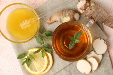 Photo of Flat lay composition of tea with mint, honey, lemon and ginger on table