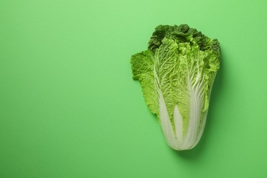 Fresh ripe Chinese cabbage on light green background, top view. Space for text