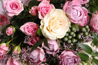 Photo of Beautiful bouquet with roses as background, closeup