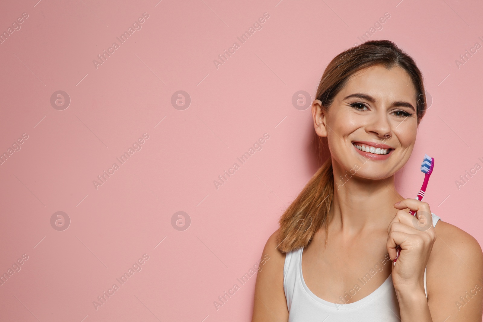 Photo of Portrait of woman with toothbrush on color background. Space for text