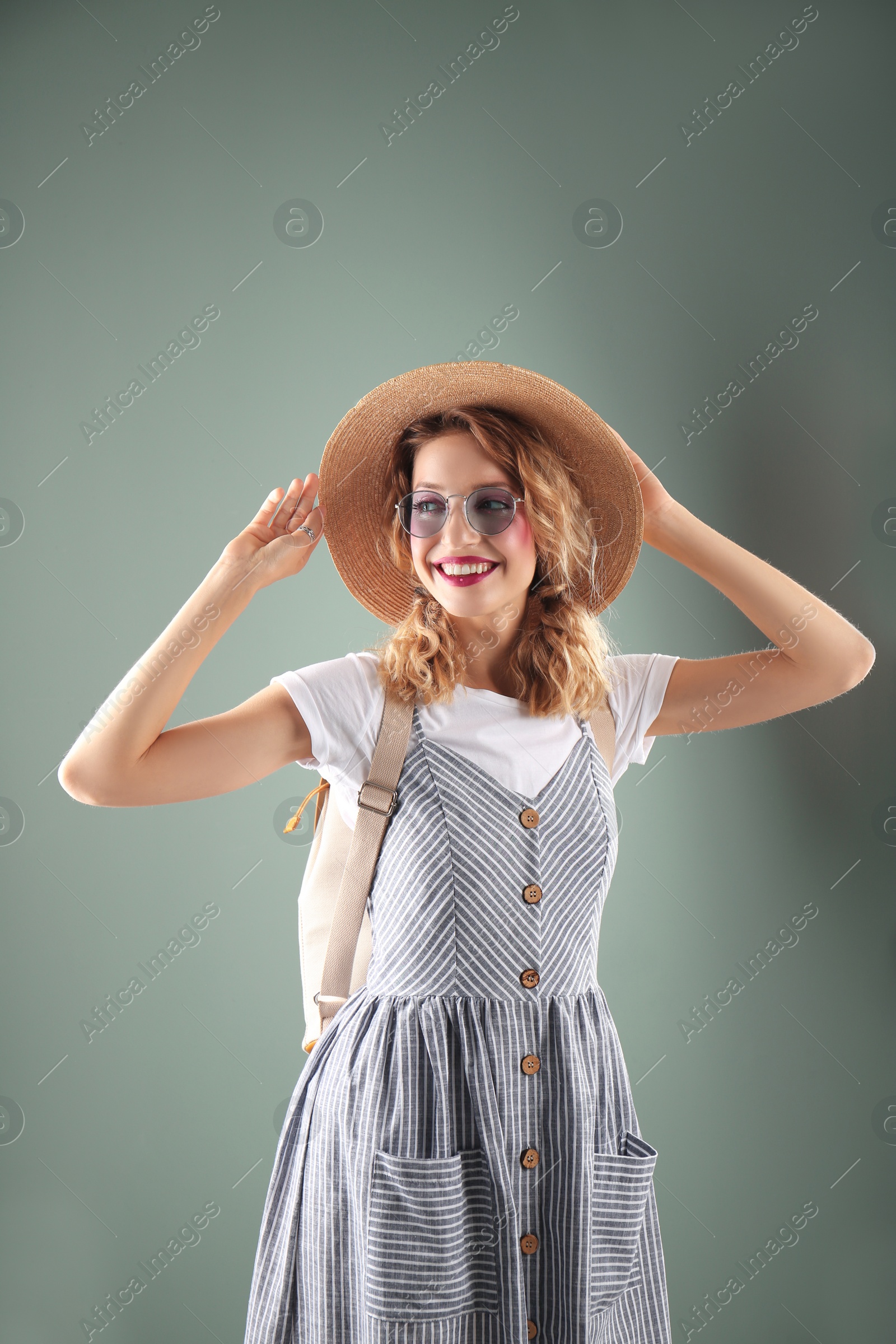 Photo of Beautiful young woman posing on color background. Summer fashion