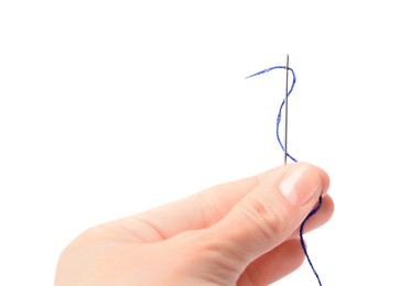 Photo of Woman holding sewing needle with thread on white background, closeup