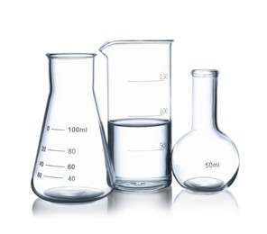 Photo of Glass flasks and beaker with water isolated on white