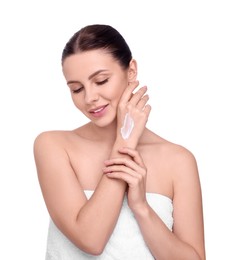 Photo of Beautiful woman with smear of body cream on her hand against white background