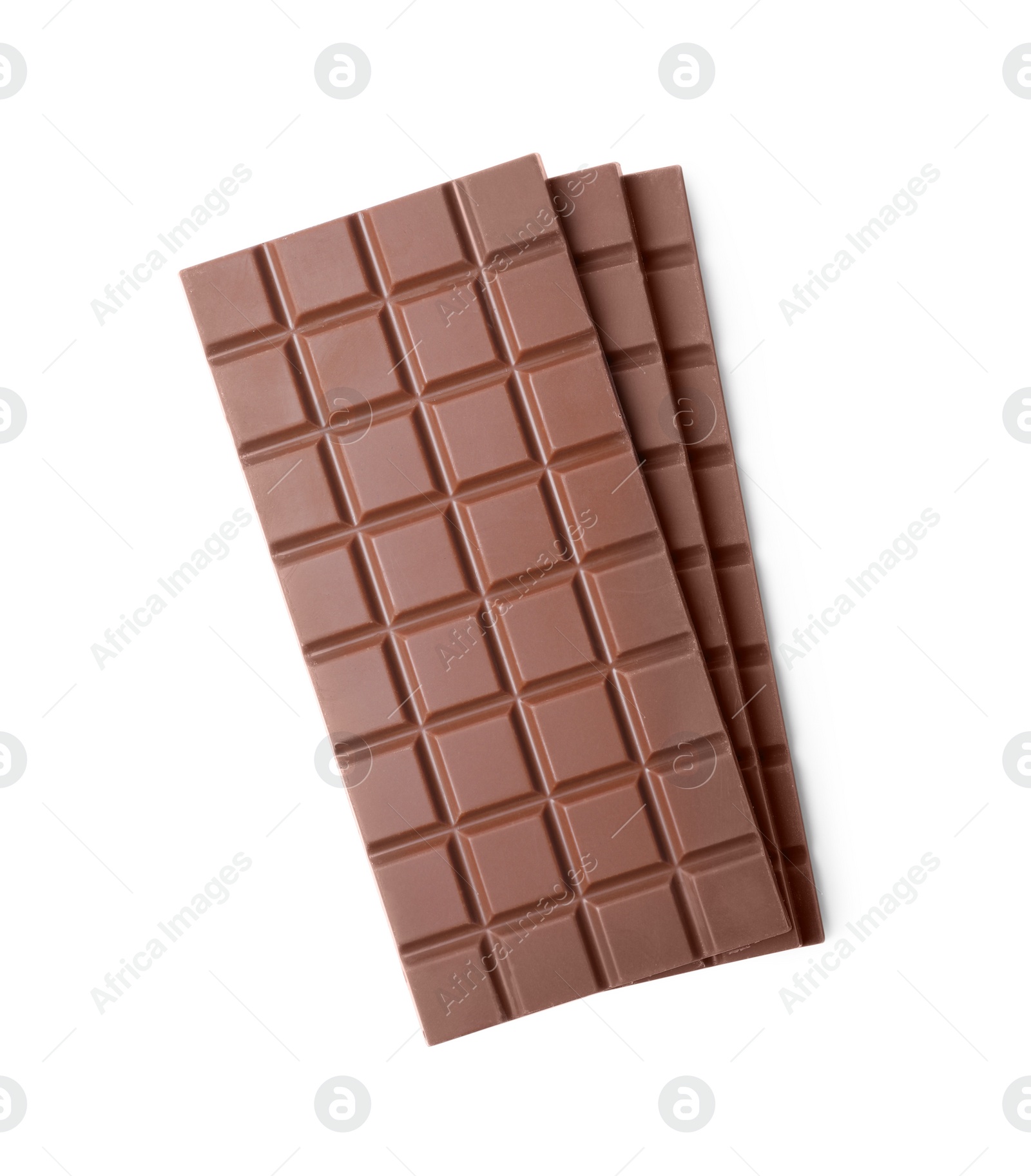 Photo of Delicious milk chocolate bars isolated on white, top view