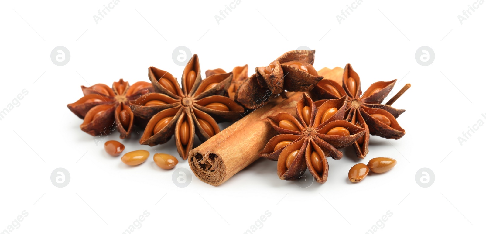 Photo of Dry anise stars and cinnamon stick on white background