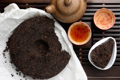 Photo of Flat lay composition with pu-erh tea on wooden tray
