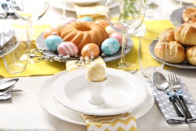 Photo of Festive Easter table setting with traditional meal