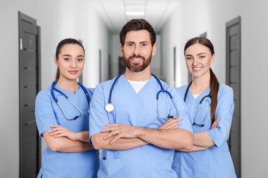 Photo of Team of smart medical students in college hallway