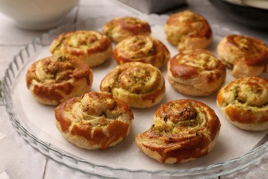 Fresh delicious puff pastry with tasty filling on tray, closeup