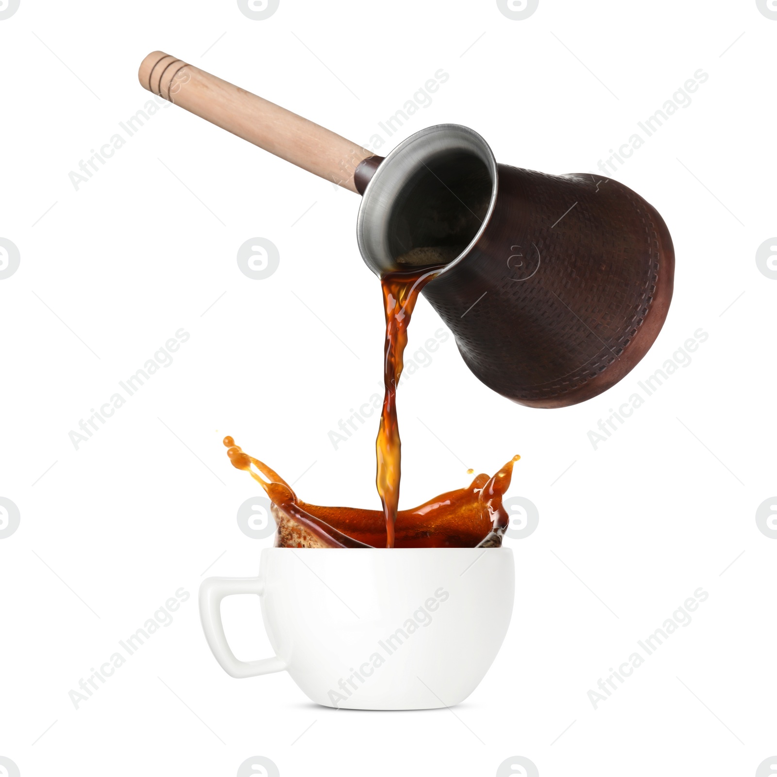 Image of Pouring freshly brewed aromatic coffee from turkish pot into cup. Objects in air on white background