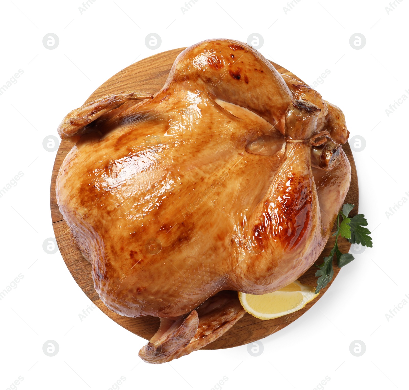 Photo of Tasty roasted chicken with parsley and lemon isolated on white, top view