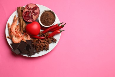 Photo of Natural aphrodisiac. Different products and heart model on pink background, top view. Space for text