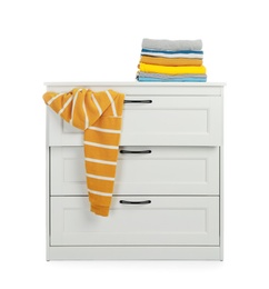 Photo of Modern wooden chest of drawers with clothes on white background