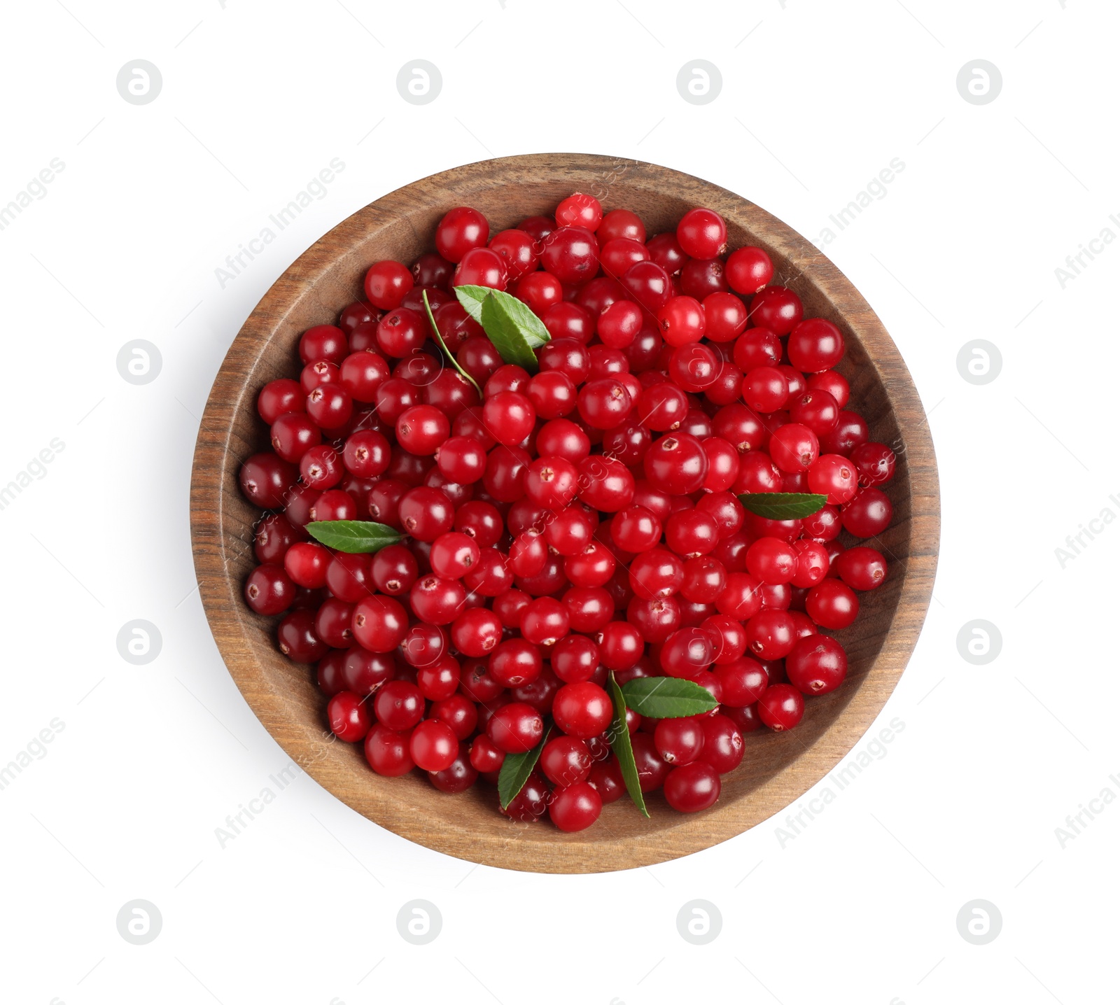 Photo of Fresh ripe cranberries with leaves in bowl isolated on white, top view