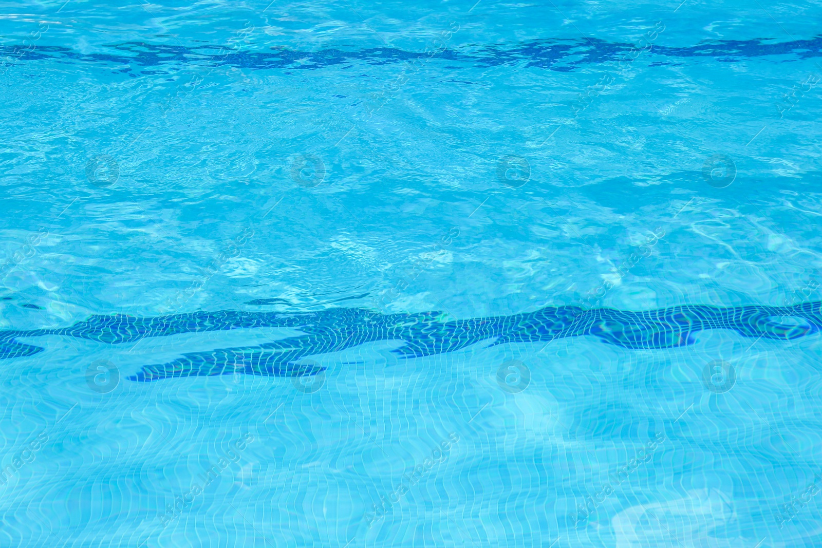 Photo of Outdoor swimming pool with clear rippled water