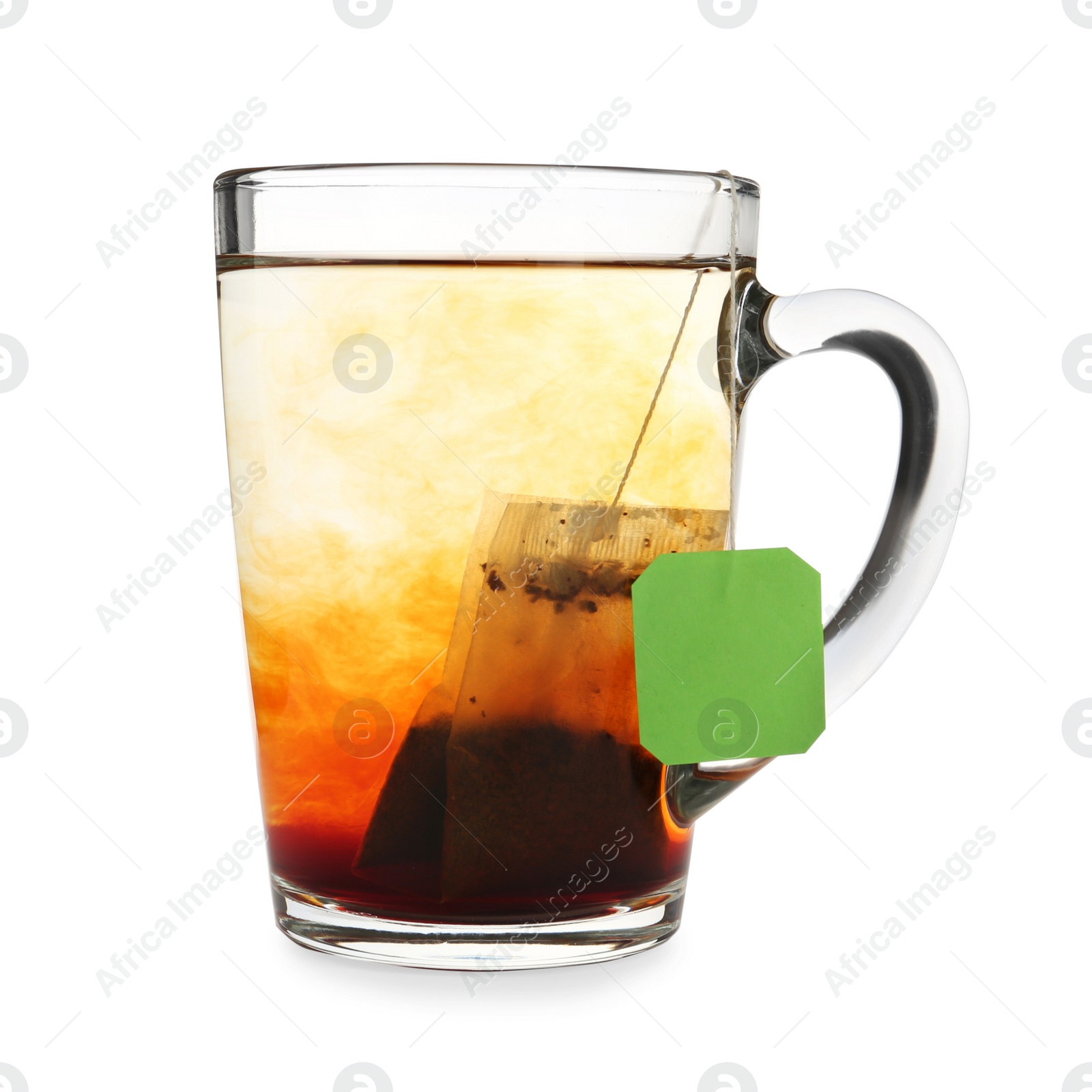 Photo of Tea bag in glass cup of hot water isolated on white